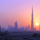 The Burj Khalifa (C) skyscrapper is seen as the sun sets over Dubai, October 5, 2010. REUTERS/Mosab Omar